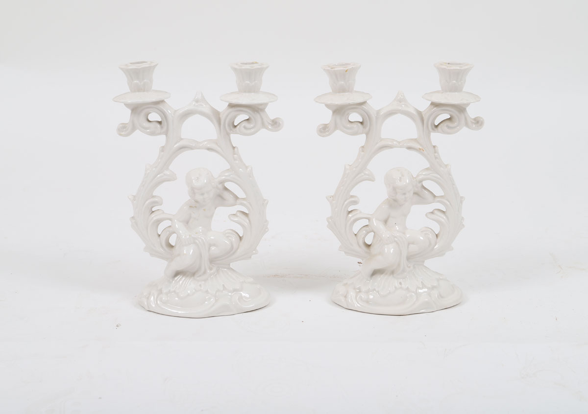 Pair of putto candlesticks