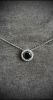 White gold pendant centered with a rare round modern cut black diamond weighing 1.10 c approx. in a setting of round modern cut diamonds G/VS for 0.20 c approx. - Gold 2.93 g