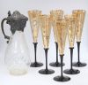 Six champagne flutes and a decanter