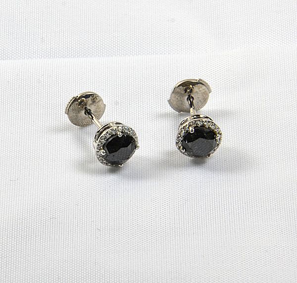 Pair of white gold earrings centered with 2 rare black diamonds weighing together 1.99 c in a setting of 36 modern cut white diamonds G/VS - Gold 3.28 g