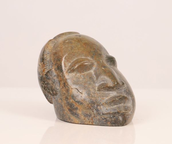 Head of native in hard stone carved