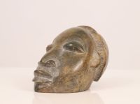 Head of native in hard stone carved