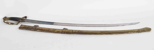 Light cavalry saber. Bronze mounting with a branch of guard with modulated decoration. Spindle mounts. Ebony fuse with checkering. Blade with hollow sides engraved floral decoration and blued.