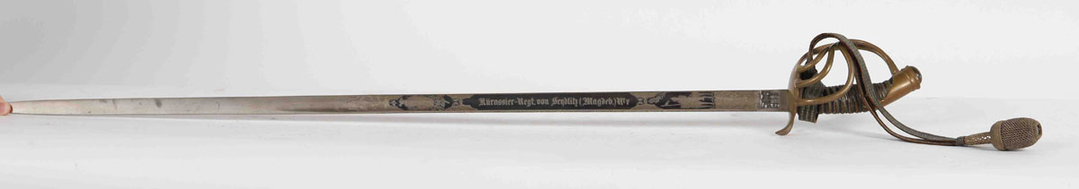 Officer's saber. Regiment of cuirassiers N°7 Von Seydlitz. Magdeburg. Bronze handle 4 branches. Leather spindle, copper filigree, straight blade with hollow sides. Engraving on 2/3 of the 2 sides and on the back (cavalry charges). 