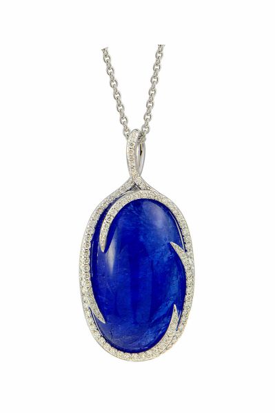 White gold pendant centered with a large oval Natural Tanzanite cabochon weighing 33.75 c. Stylized and modern setting set with 106 round modern cut diamonds G/VS - Gold 6.75 g. 