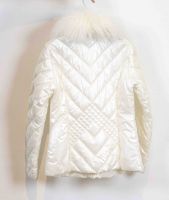 White parka with removable goat fur collar.