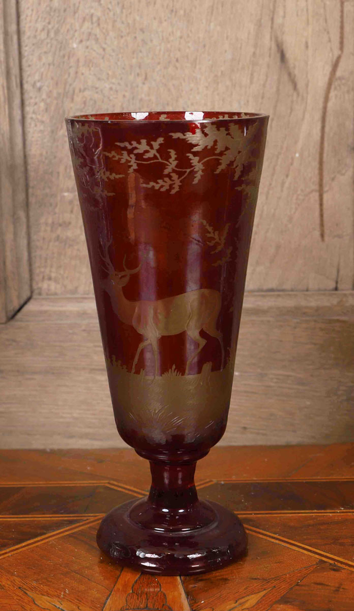 Vase in glass paste decorated with a deer, on a pedestal.