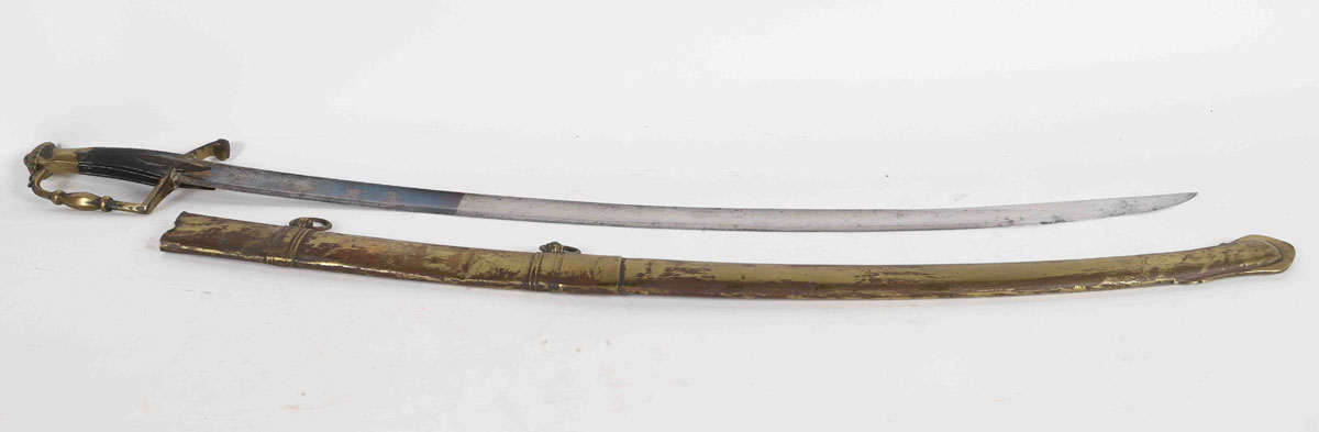 Light cavalry saber. Bronze mounting with a branch of guard with modulated decoration. Spindle mounts. Ebony fuse with checkering. Blade with hollow sides engraved floral decoration and blued.