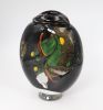 Black vase with green, yellow and red lined decoration. Unique piece