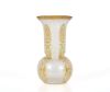 Small spherical vase with high flared neck and acid-etched decoration of yellow palmettes on a transparent vermiculated ground. 