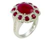 Bague en or blanc sertie 4 griffes d'un rubis ovale Naturel Birman d'un rouge intense pesant 4,03 c dans un entourage de rubis ronds pour 2 c env entrelacés de 112 diamants ronds taille moderne G/VS - Or 8,74g. 